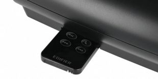 Image of the remote control being inserted into its holder